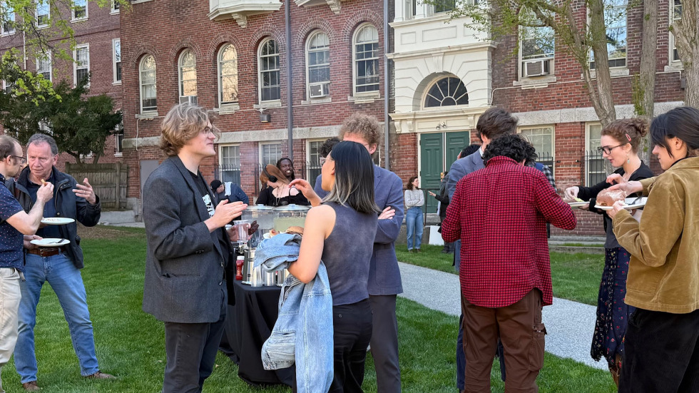 People eating at Urban Studies BBQ celebration