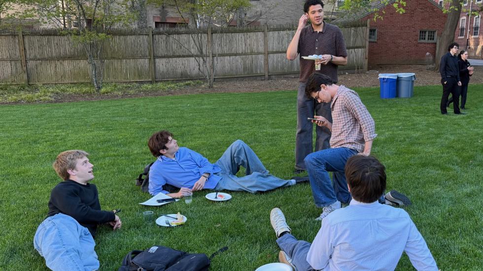 People chatting outside on lawn